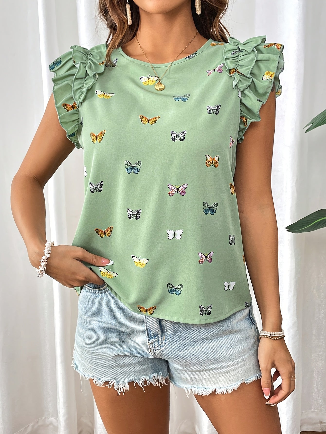 Islyn | Vakantietop voor dames – Elegante blouse met vlinderprint en ruches aan de mouwen