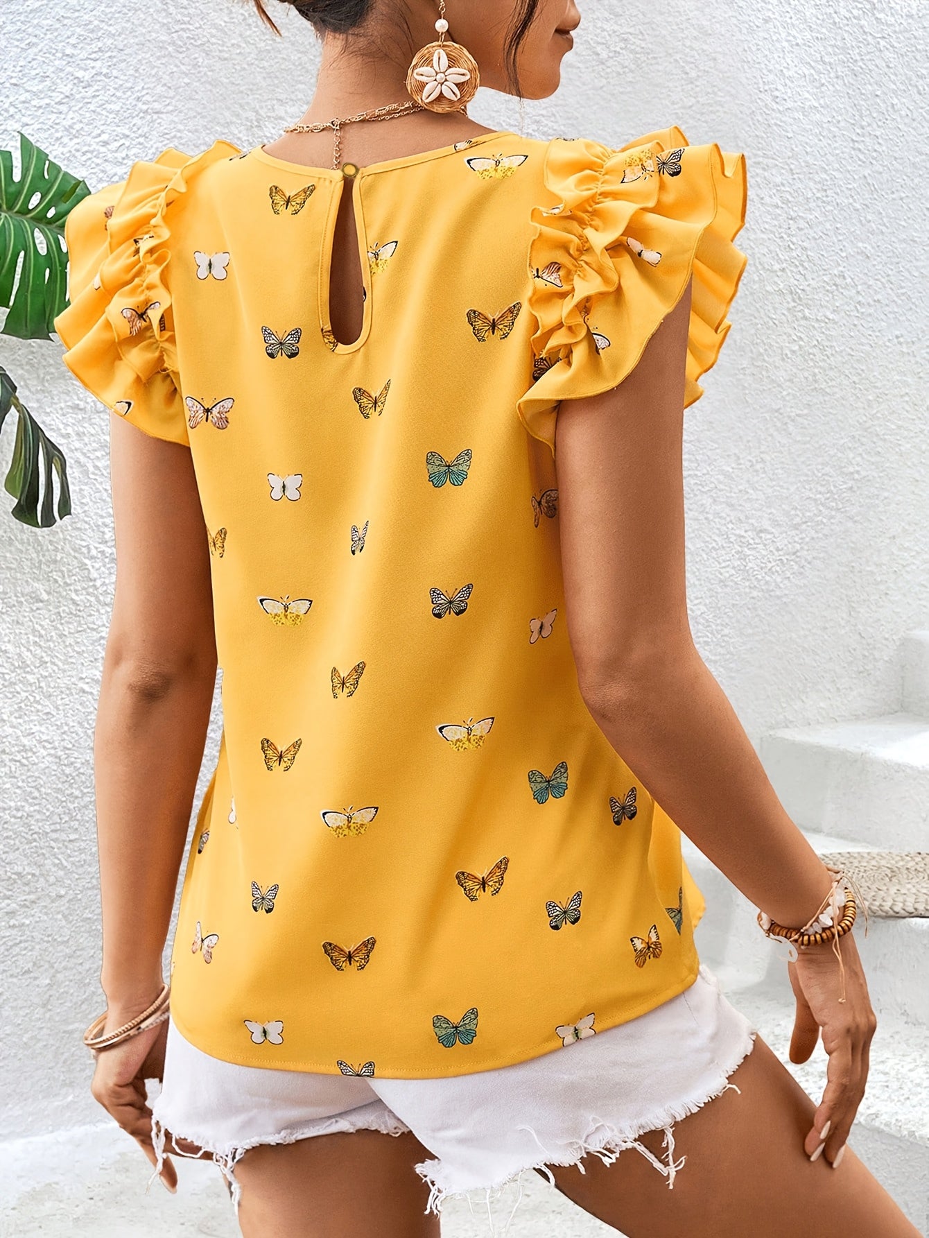 Islyn | Vakantietop voor dames – Elegante blouse met vlinderprint en ruches aan de mouwen
