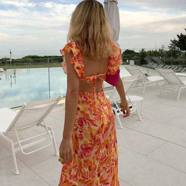 Xandra | Dames oranje zomerjurk – midi zonnejurk met ruches
