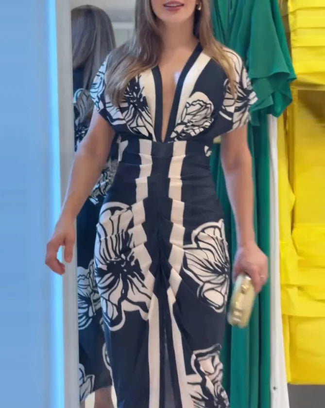 Airi | Zomerse midi-jurk met bloemenprint – Lichte, casual en elegante damesjurk met print