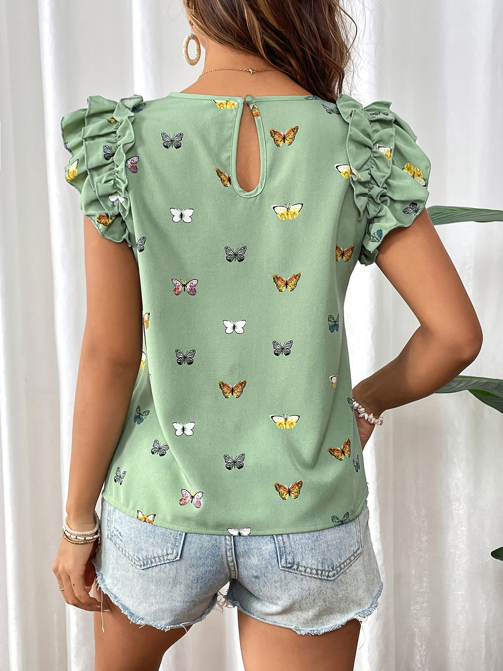 Islyn | Vakantietop voor dames – Elegante blouse met vlinderprint en ruches aan de mouwen