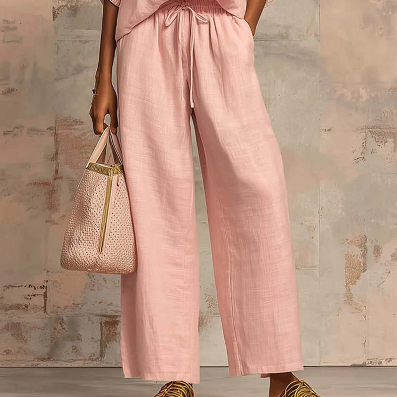Elzoria | Elegante tweedelige damesoutfit: top met pofmouwen en palazzo-broek met wijde pijpen