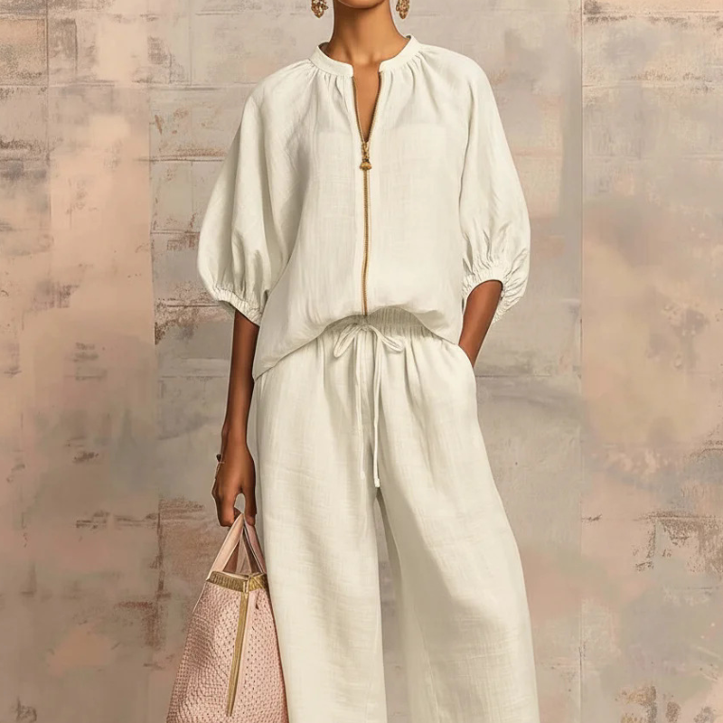 Elzoria | Elegante tweedelige damesoutfit: top met pofmouwen en palazzo-broek met wijde pijpen